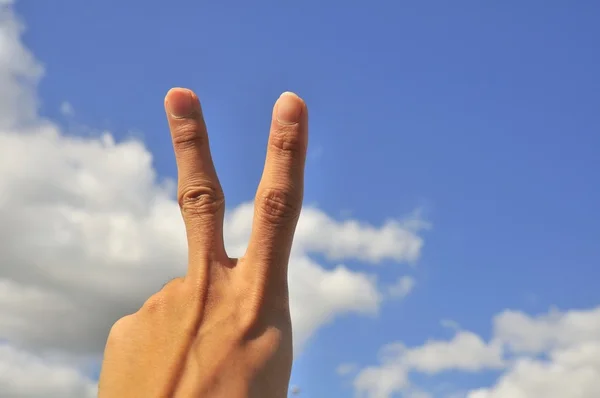 stock image Hand of male showing victory sign