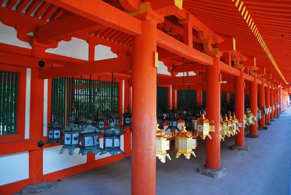 Metal, traditional lanterns hanging outside a shrine — Stock Photo, Image
