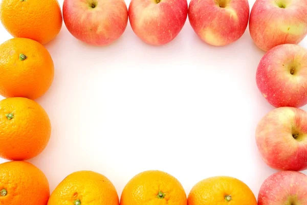 Oranges and apples forming a fruit frame — Stock Photo, Image