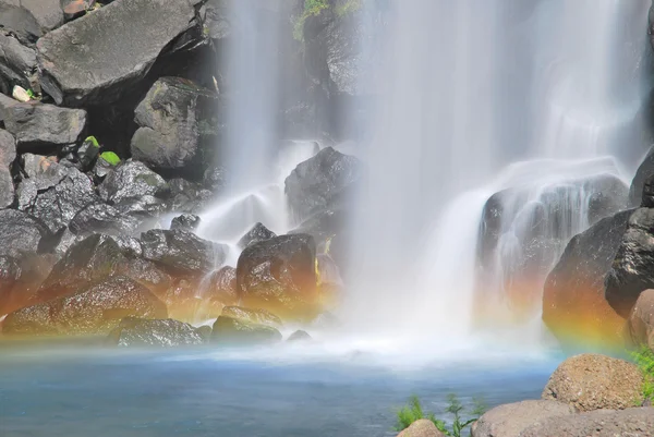 Majestic waterfall with colorful rainbow — Stock Photo, Image