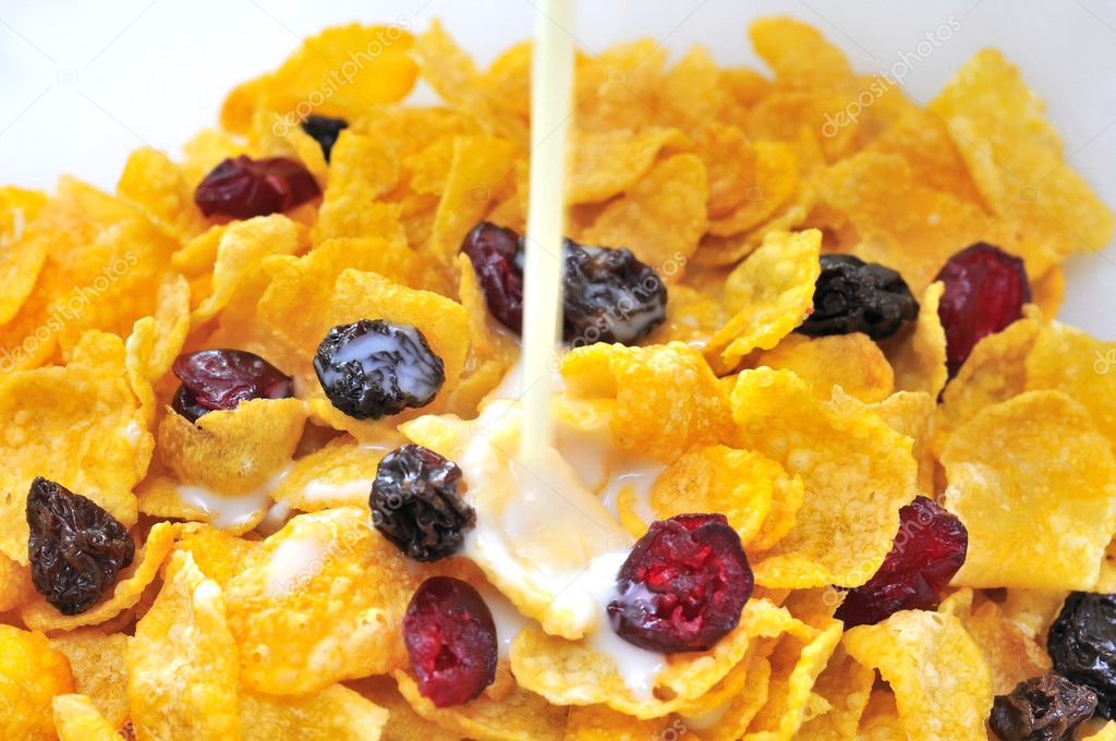 Soya milk pouring into healthy cereal — Stock Photo © gnohz 5849819