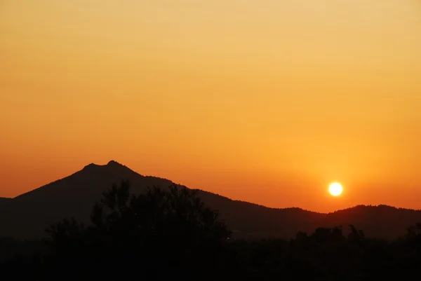 stock image Serene sunset behind mountains