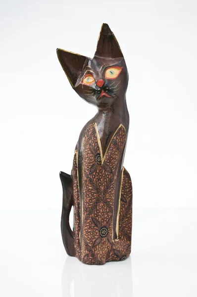 Beautifully colored wooden cat with pleading eyes — Stock Photo, Image