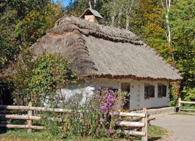 Ancient hut with a straw roof clipart