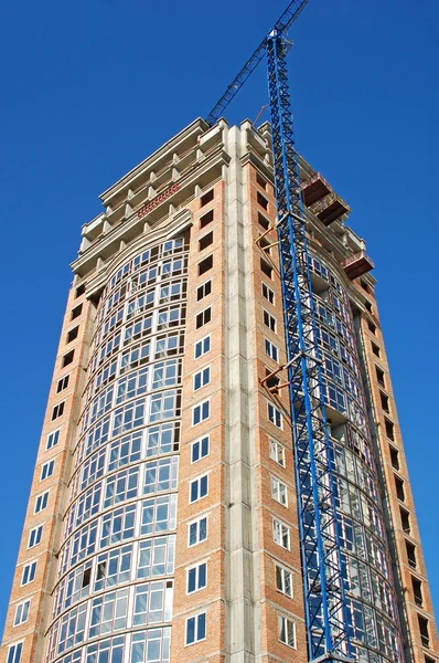 stock image Crane and highrise construction site