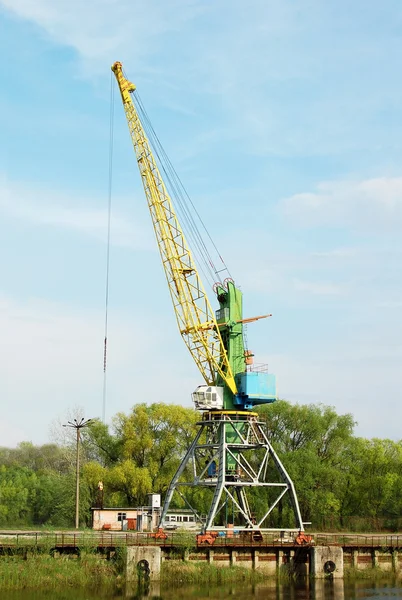 Cargo crane in abandoned river harbor — Stock Photo, Image