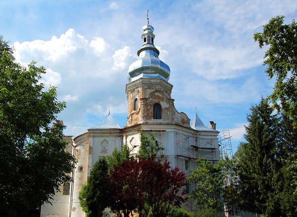 Antique stone baroque bell tower in Ukraine