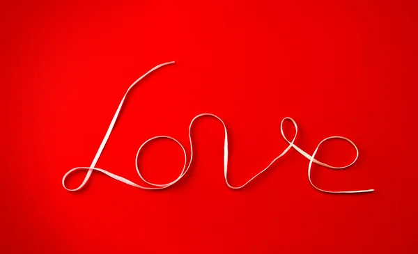 Palabra 'amor' escrita por una cinta —  Fotos de Stock