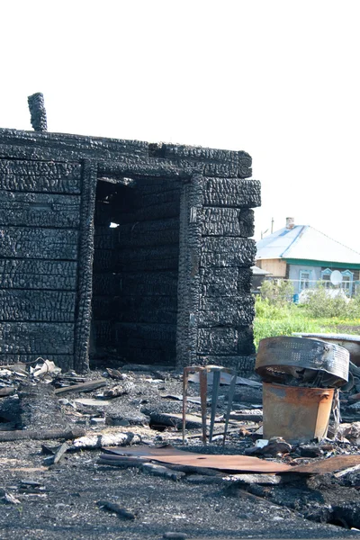 stock image The burnt down house in village