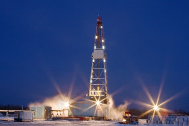 Drilling Rig in the night clipart