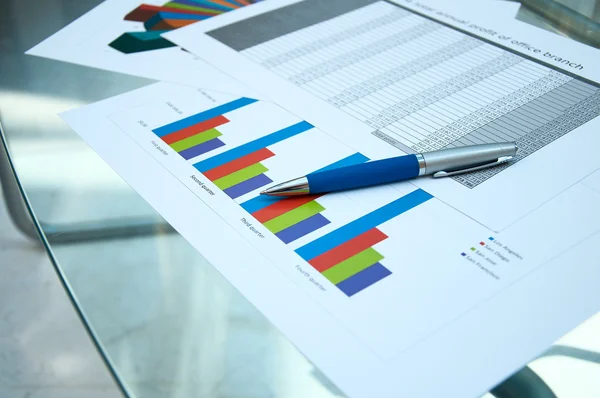 Papers, charts of growth, a table — Stock Photo, Image