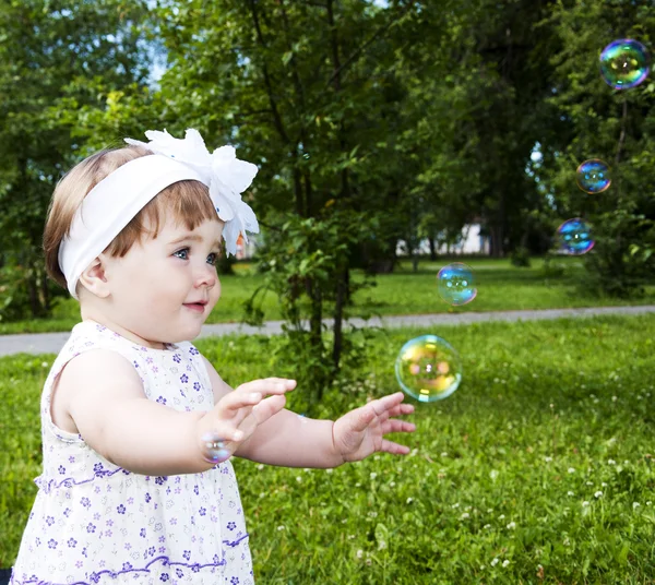 Girl with soap bubble — Stock Photo, Image