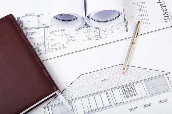 Construction plans, pen, notepad — Stock Photo, Image