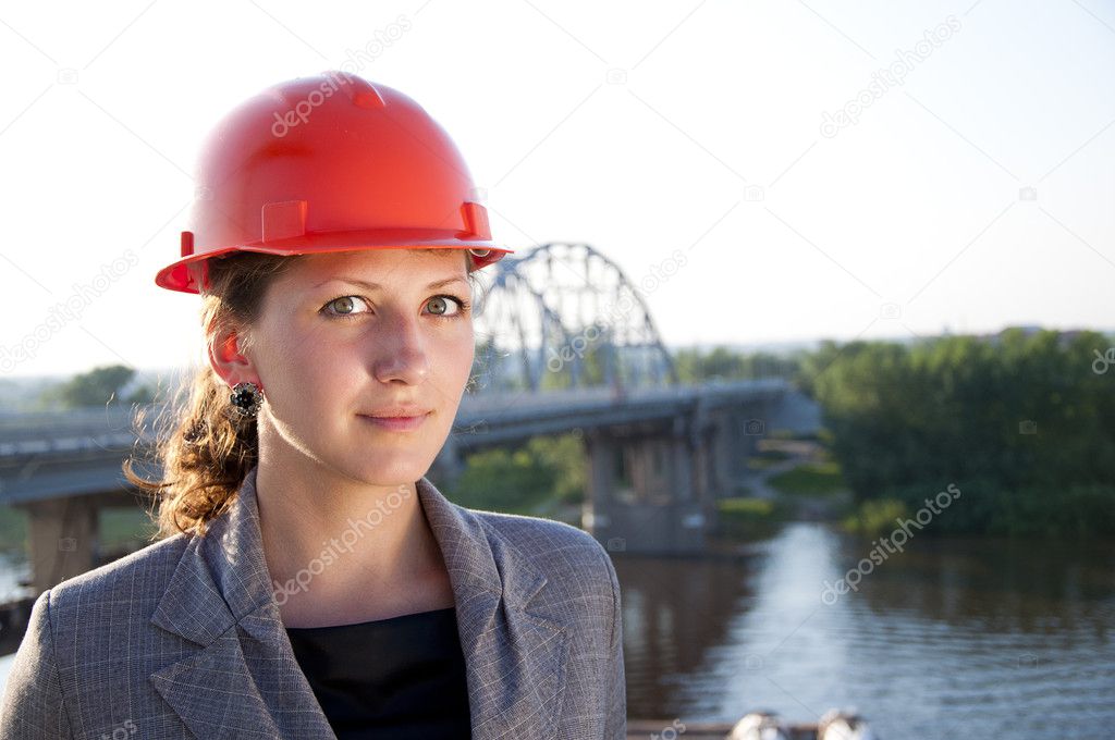 Young architect-woman wearing a protective helmet