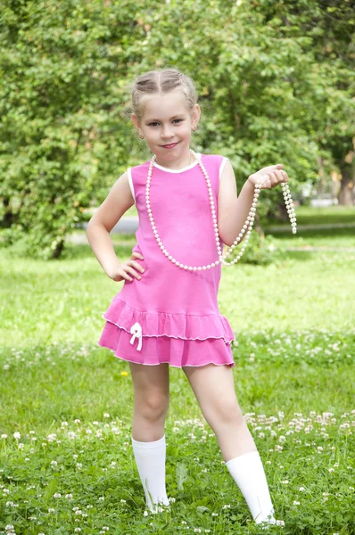 stock image Portrait of a young blond girl in pink dress