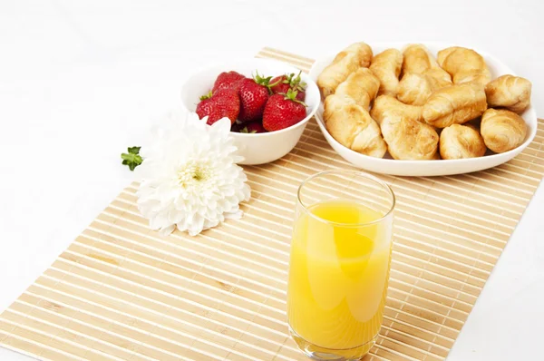 Juice, croissants and Berries On a bamboo napkin — Stock Photo, Image