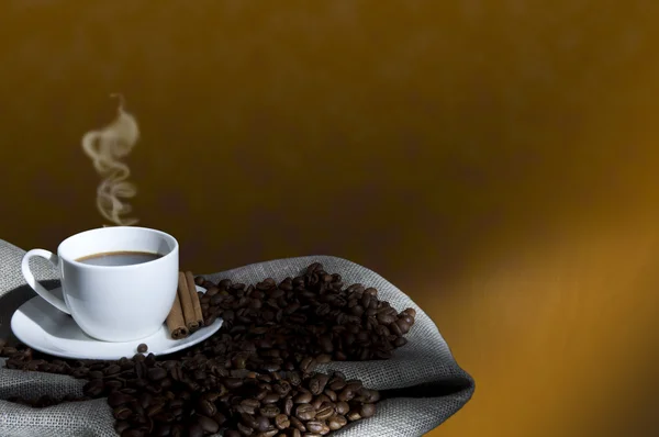 Coffee beans and coffee cup, collage — Stock Photo, Image