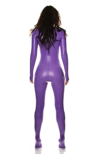 Sexy Female Wearing Purple Shiny Catsuit in The Studio — Stock Photo, Image