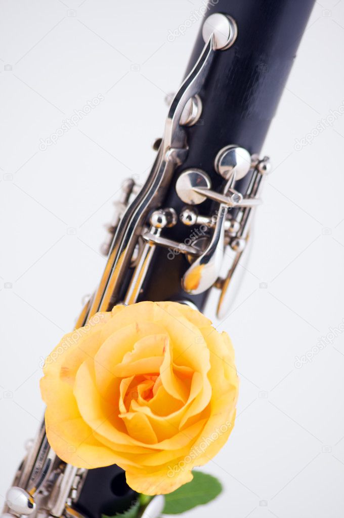 Clarinet with Yellow Rose Isolated on White