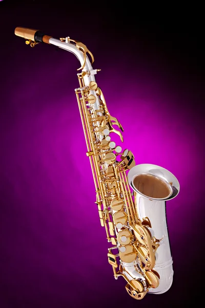 Saksofon altowy na różowym tle — Zdjęcie stockowe