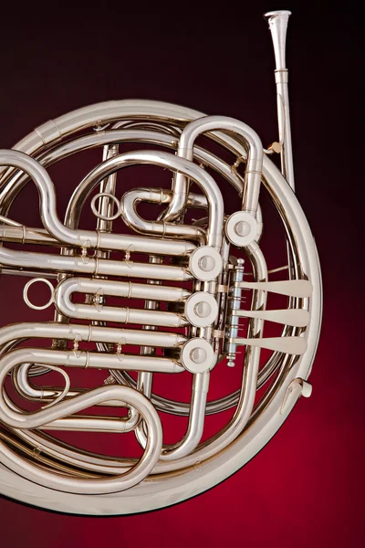 Silver French Horn Isolated on Red — Stock Photo, Image