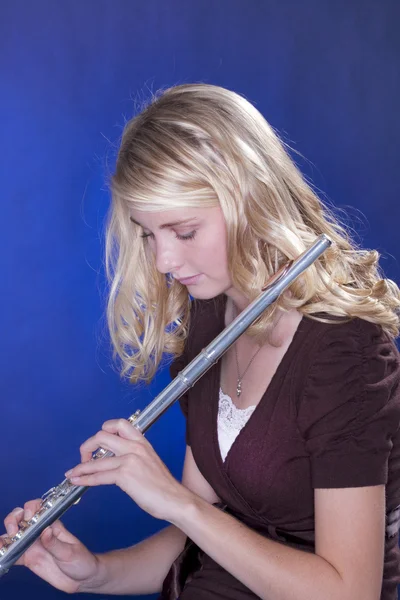 Flute Player Isolated on Blue — Stock Photo, Image
