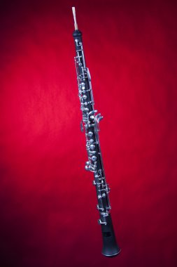 Oboe Isolated on Red Background clipart