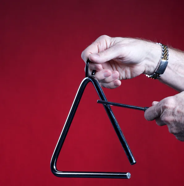 Triángulo jugado aislado en rojo — Foto de Stock
