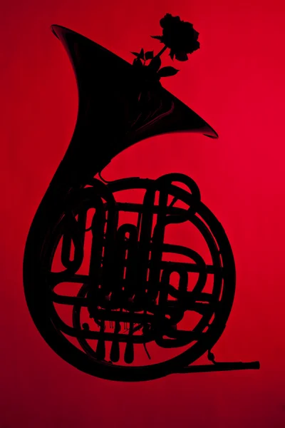 French Horn Silhouette on red