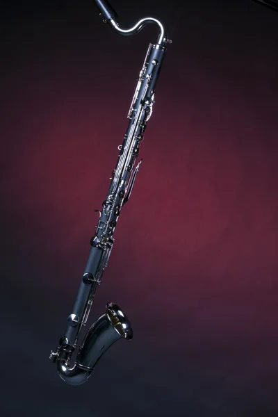 Bass Clarinet Isolated on Red Spotlight — стоковое фото