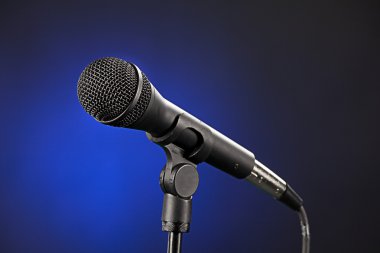 Microphone Isolated on Blue clipart