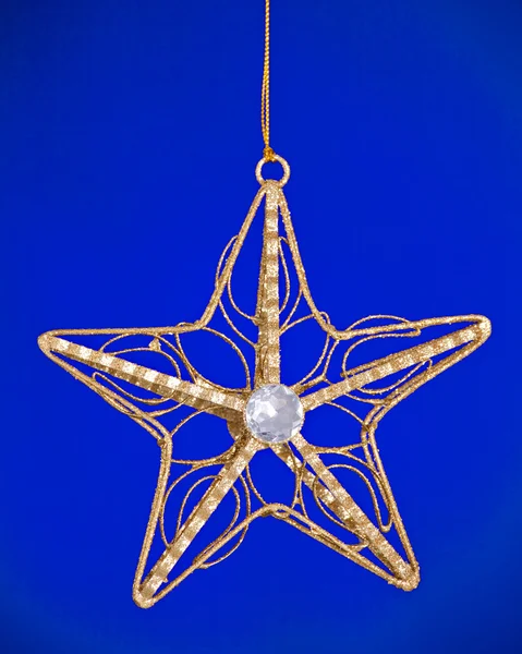 Christmas Tree Star Ornament on Blue — Stock Photo, Image
