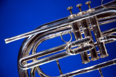 Marching French Horn Isolated on Blue clipart