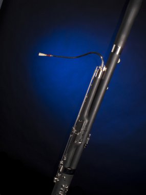 Bassoon Isolated In Blue Spotlight clipart