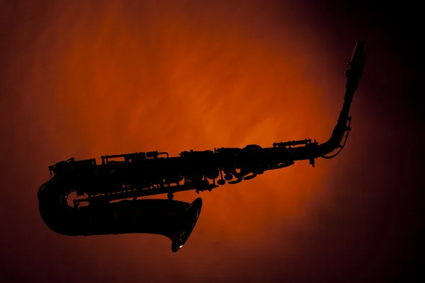 Saxophonsilhouette isoliert auf Gold — Stockfoto