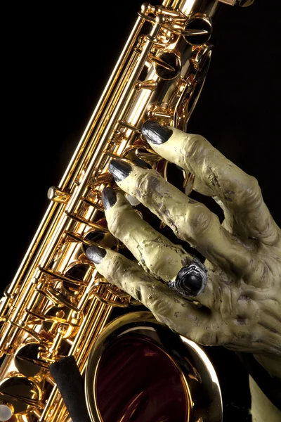 Halloween saxofon monsterhand — Stockfoto