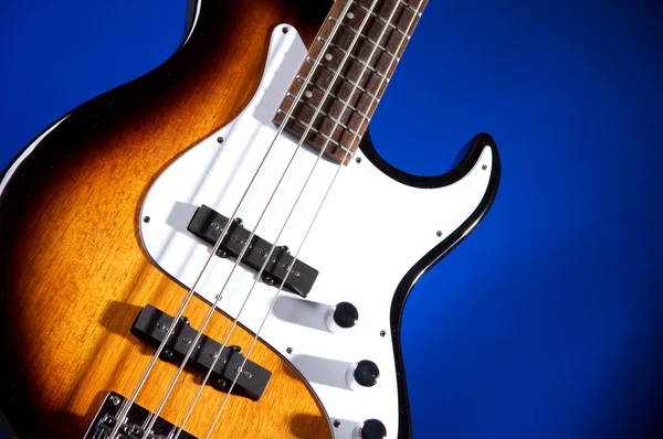 Bass Guitar Isolated on Blue — Stock Photo, Image