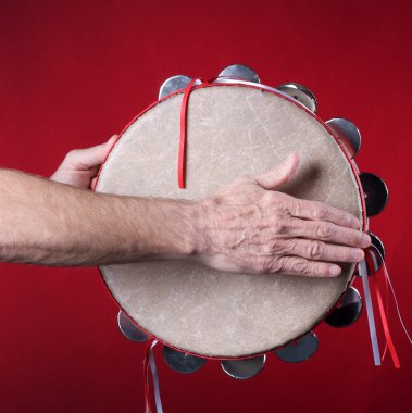 Tambourine Played On red clipart