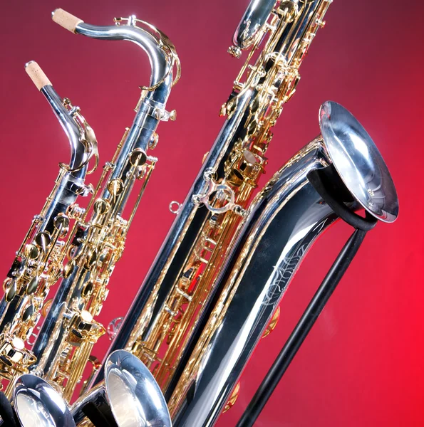 Three Saxophones on Red — Stock Photo, Image