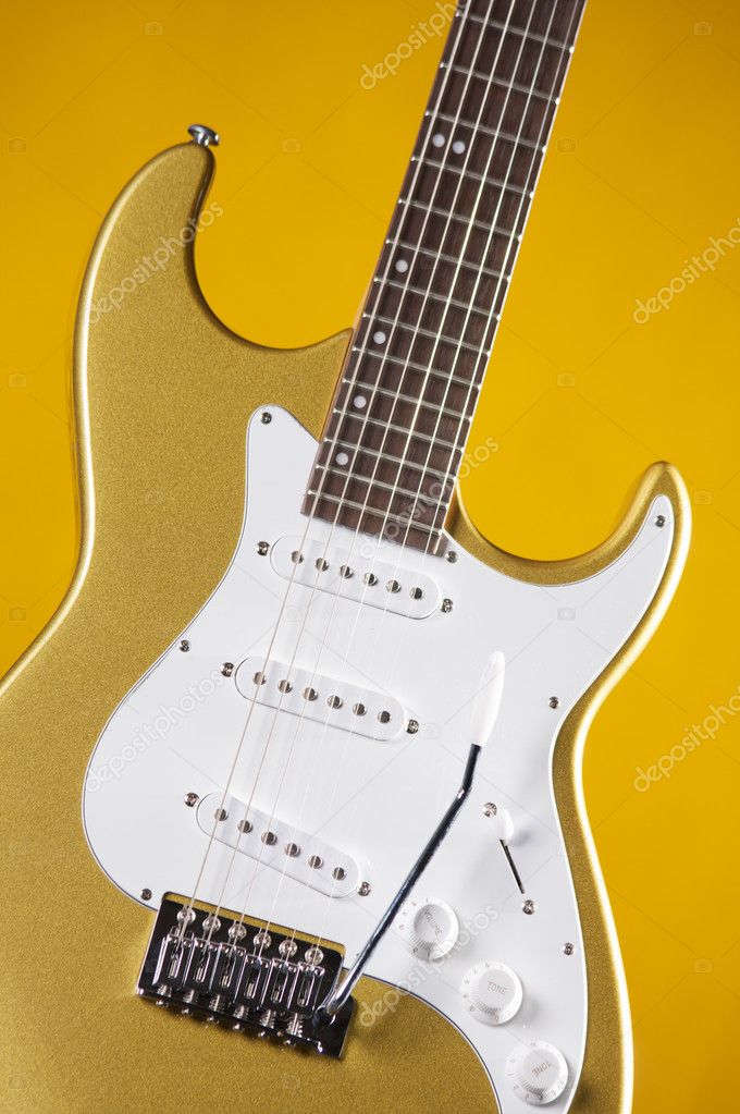 Guitar gold Metallic Isolated on Yellow — Stock Photo © mkm3 6706229