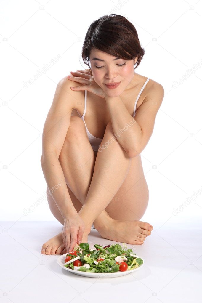 Beautiful girl with salad meal