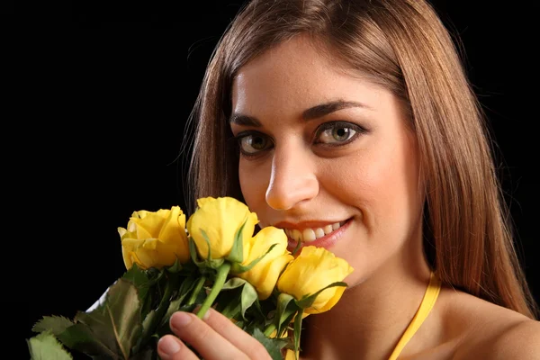 Woman recieving yellow rose flowers — Stock Photo, Image