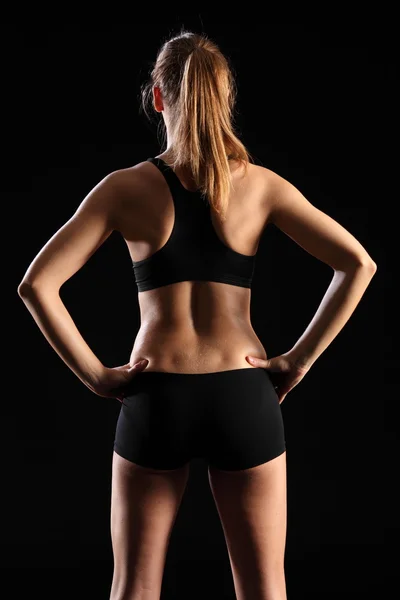 Back of woman in sports outfit — Stock Photo, Image
