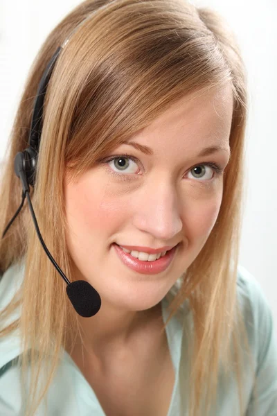 Blond vrouw met headset — Stockfoto