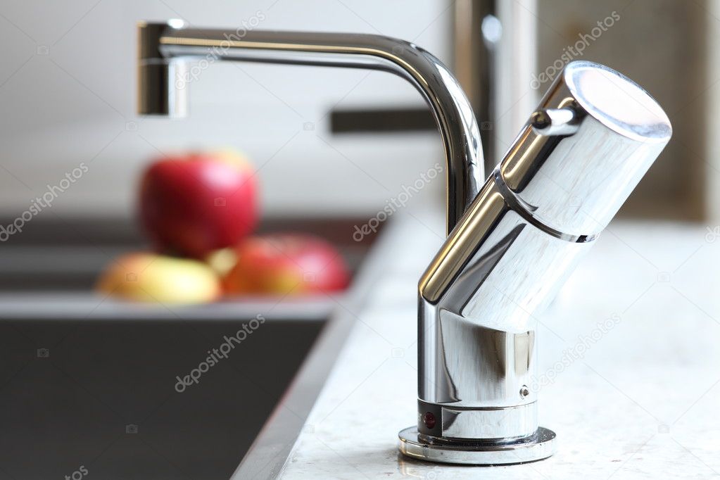 Stylish home tap and red apples