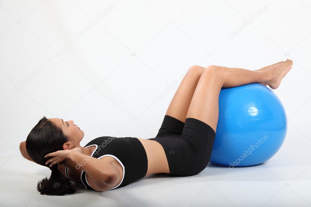 Stomach crunch exercise by athletic girl