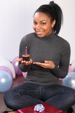 Chocolate cream birthday cake for smiling girl clipart