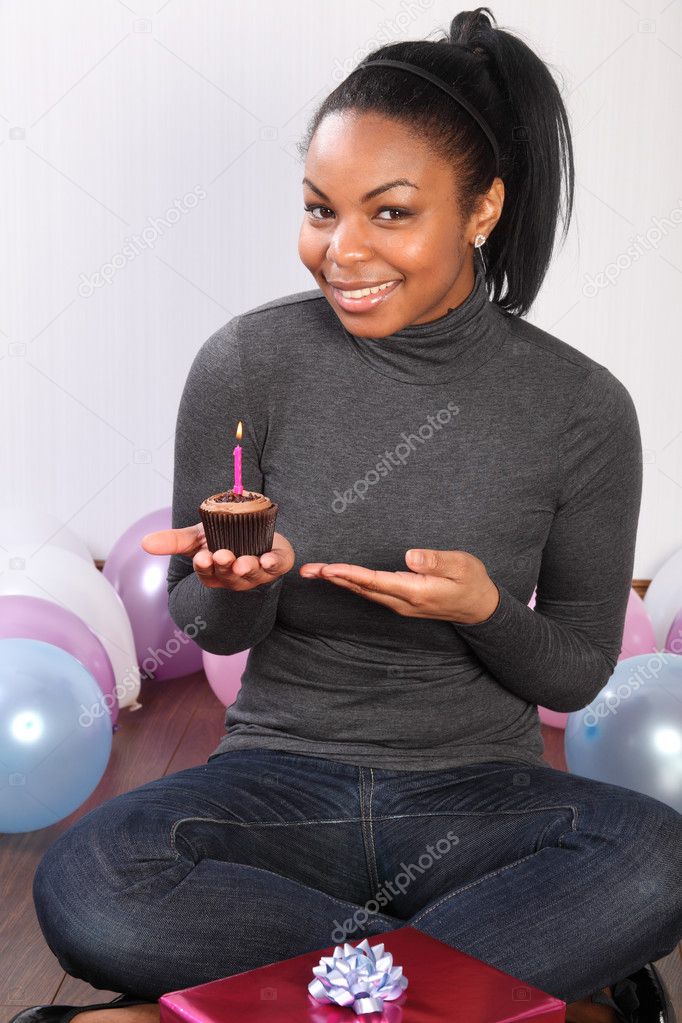 Chocolate cream birthday cake for smiling girl