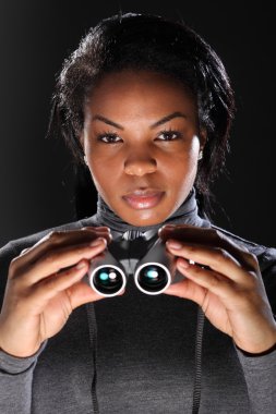 Female secret agent spy holding binoculars clipart