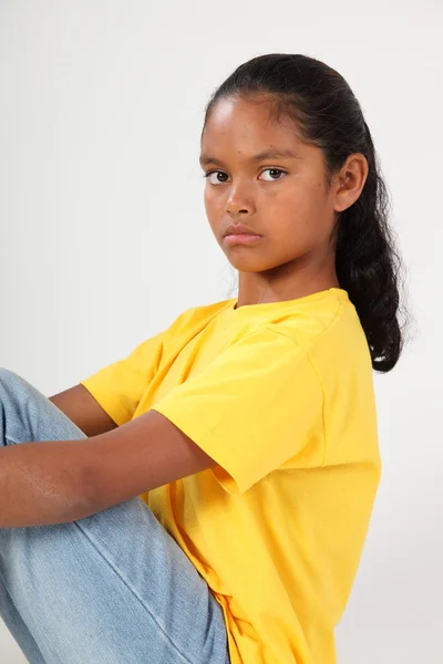 Serious look from young school girl — Stock Photo, Image